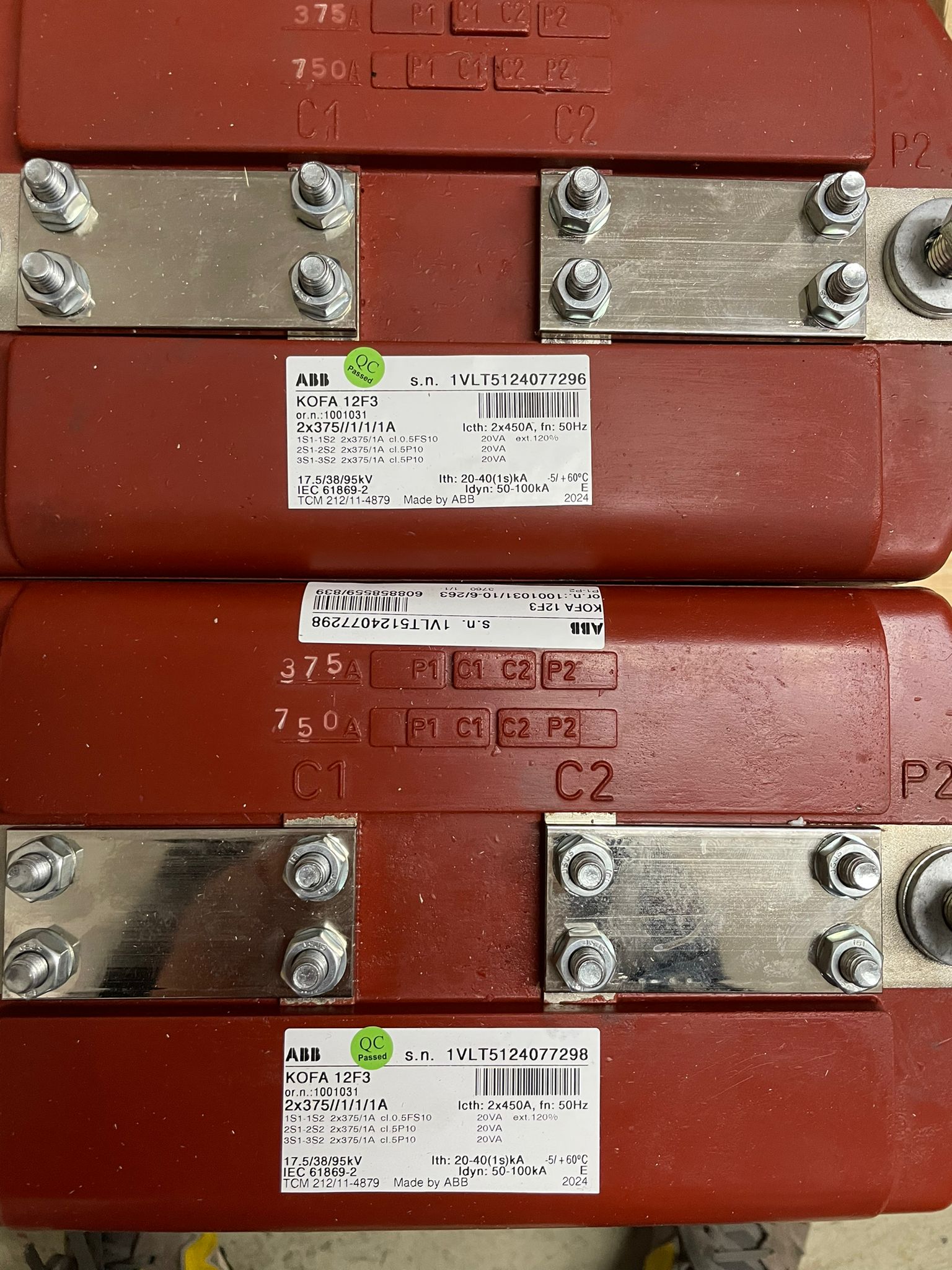 Original project photograph of ABB KOFA 12F3 current transformers supplied to Bangladesh showing serial and rating labels