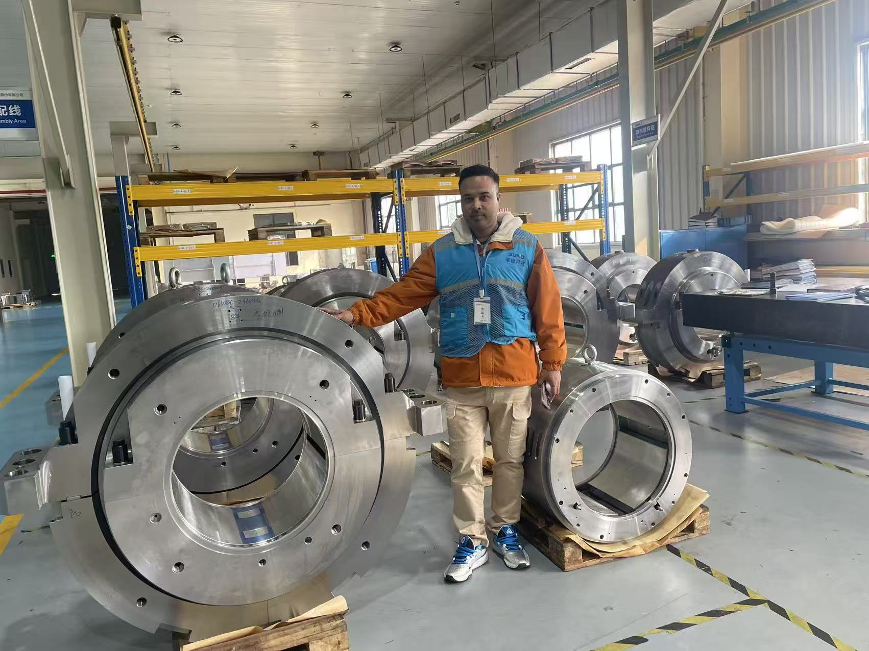 Large radial and thrust bearing housings and assemblies on SUND production floor during power plant order follow up